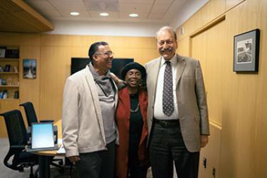Don Williams, Adilah Barnes, and UC Santa Cruz Chancellor George Blumenthal enjoy a moment of celebration in the chancellor's office last week, where Barnes received the Distinguished Alumni Achievement Award. (photo by Yin Wu)