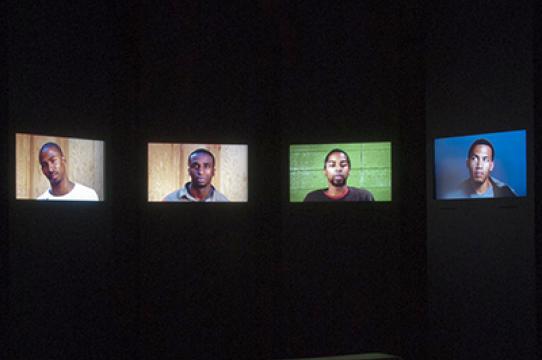 Question Bridge: Black Males video screens
